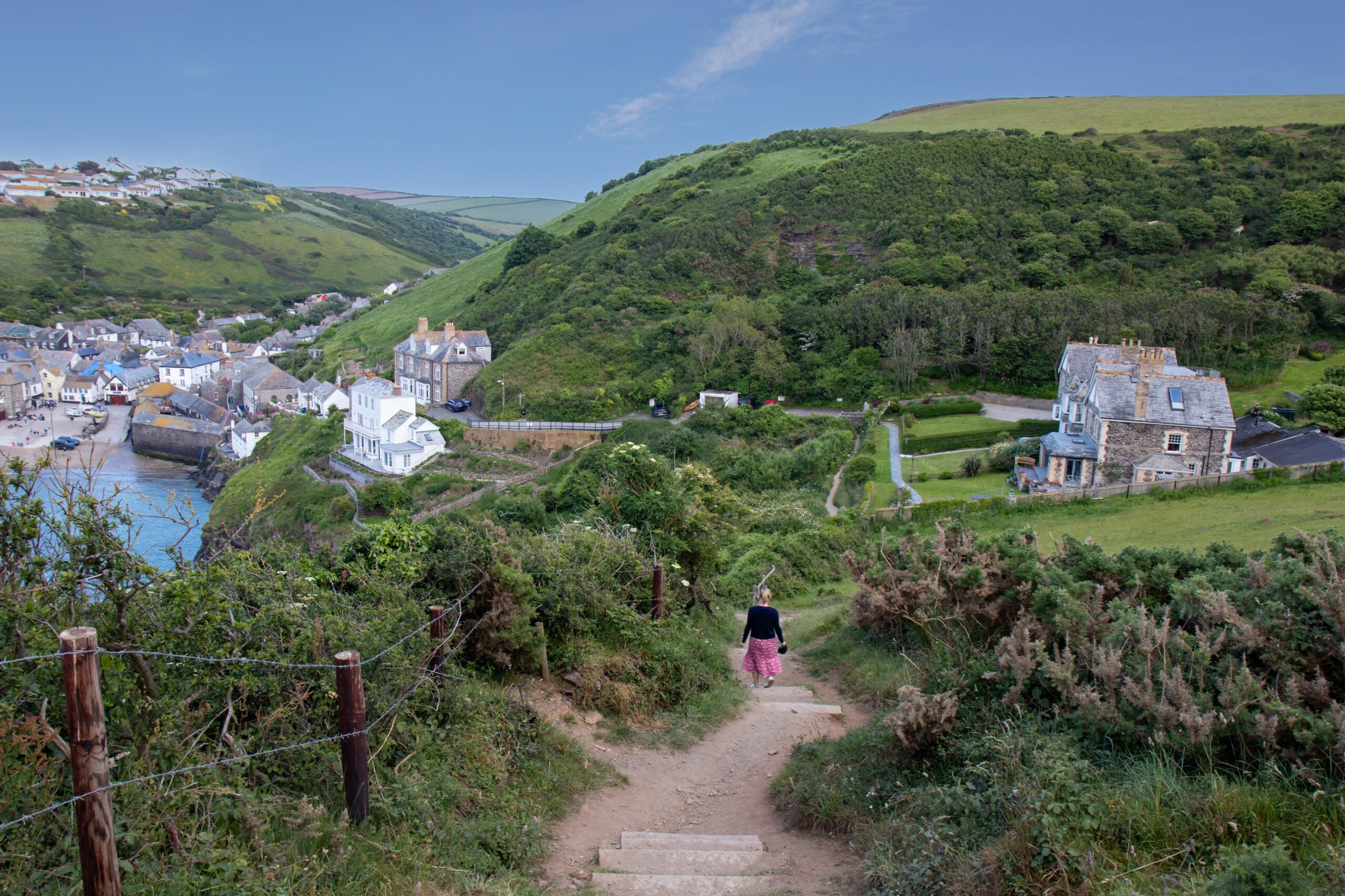 Allison walking down the footpath into the North Cornwall fishing village Port Isaac